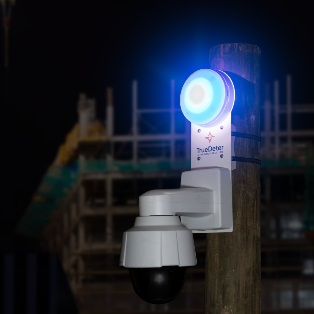 A TrueDeter unit on a jobsite at night using it's strobes to blink and scare off intruders for jobsite security